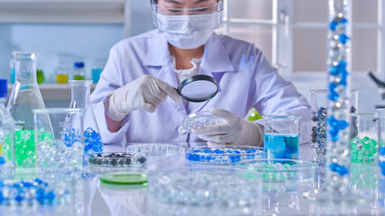Advertising photo of experimental theme, a professional scientist sitting at the lab table, which...