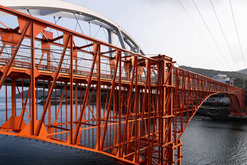 bridge of orange color on the sea