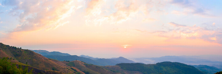 Banner Scenic view dramatic beautiful sunset sky. Panorama Natural Sunset Sunrise on meadow silhouette shadow dark land. Vibrant dramatic sky in Countryside. Landscape Sky At Sunset with copy space