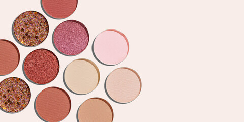 Colorful Swatches eyeshadow refills as minimal geometric pattern, banner with copy space. Matte and glitter pans with sun shadows, detail texture, cosmetic, beauty product, makeup, warm color scheme