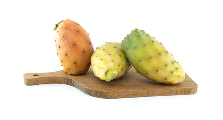Fresh prickly pears on wooden cutting board isolated on white background