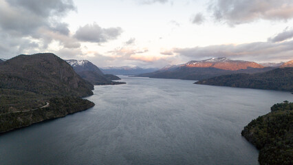 Panoramic photo of a breathtaking sunrise over Lake Lácar in San Martín de los Andes, Argentina.