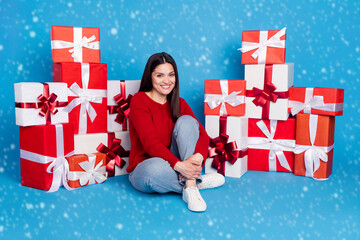 Portrait of lovely cheerful girl sitting among gifts festal occasion bargain isolated over bright...