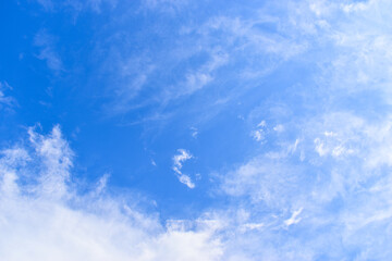 beautiful blue sky and white fluffy group of clouds with sunrise in the morning, natural background