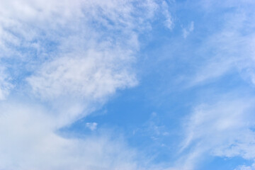 beautiful blue sky and white fluffy group of clouds with sunrise in the morning, natural background