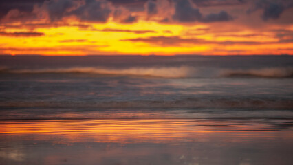 Obraz premium Abstract Beach Sunset panorama with dramatic sky and reflections