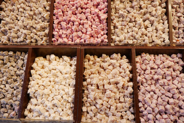 Assorted Colorful Confectionery Cubes Arranged Neatly Inside Beautiful Wooden Compartments