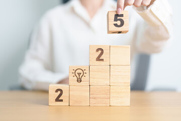 2025 year block with lightbulb. Business Idea, Creative, Thinking, brainstorm, Goal, Resolution,...