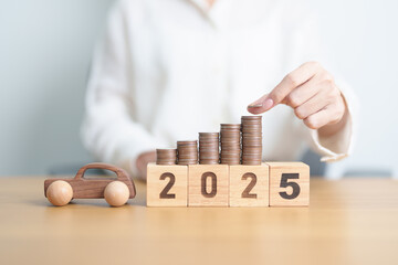Happy New Year 2025 with car model and Coins Money stack for deposit and Automobile Tax. Money...