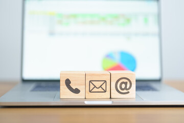 Fototapeta premium Contact Us concepts. Wood block of Email, call Phone and Website Address sign. For Customer support hotline, business Marketing, Corporate, communication and Advertising