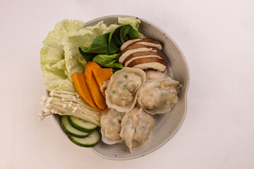Mandu or Korean Dumpling Served with Vegetables. 