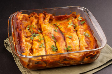 Chicken Enchiladas is Tortillas Stufed With Shredded Chicken and Top With Red Enchilada Sauce. 