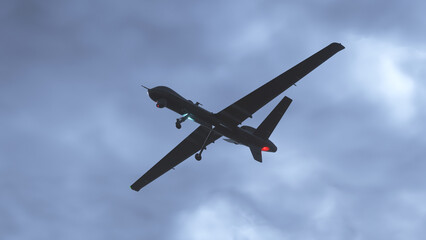 Army drone flying in dark sky . Unmanned combat aerial vehicle.