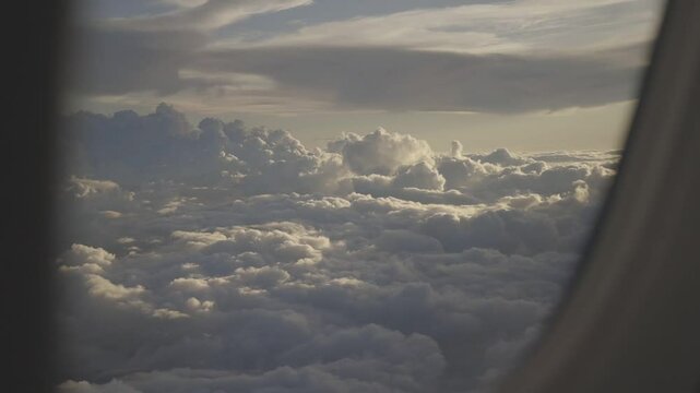 beautiful white clouds from the top of an airplane, captured canon eos R, raw c-log 8bits colour.