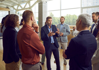Group of business people chatting on a meeting. Company employees talking in the office and making...