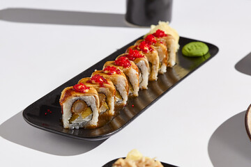 Elegant Sushi Roll with Eel, Shrimp, and Mango in Modern Minimalist Setting