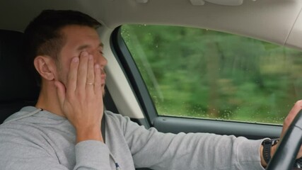 Tired man falling asleep while driving car on highway road. Sleepy male driver closes his eyes and lose concentration. Dangerous driving