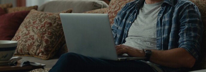 Person sitting at home working on a laptop for business or communication