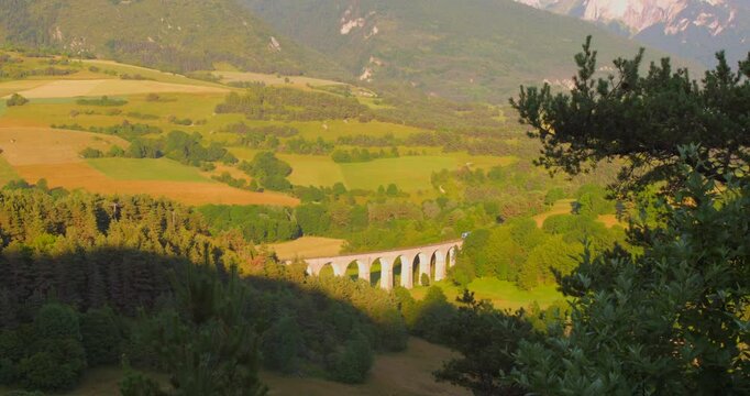 Vercors Massif and train on a bridge in magnificent landscape in France.