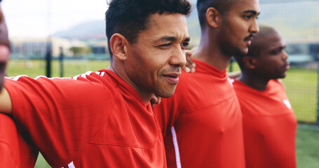 Fototapeta premium Football team, man and listening to national anthem for match, game or competition. Group, sports and soccer players together for support, solidarity or thinking at fitness field outdoor for training