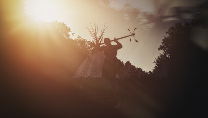 juggler silhouette performing against a sunset, showcasing dynamic movement and grace.
