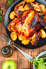 Whole roasted chicken with apples.
