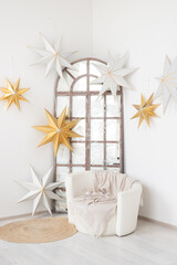 Cozy corner adorned with dazzling stars, bringing warmth and charm to a modern living space during winter