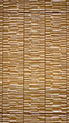 Ceramic tiles with stone patterns are arranged horizontally, creating a sleek and natural look for wall tiling that brings texture and elegance to any space.