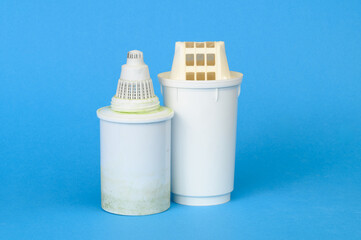 Two old used dirty water filters. Water filtration system in house to make it drinkable. World...