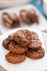 Stacked chocolate chip cookies on marble