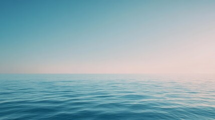 Obraz premium Calm ocean waves under a clear blue sky at dawn