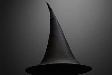 Fototapeta premium Black Witch's Hat Against Grey Background