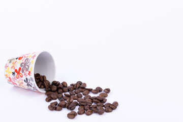 Perfectly Brewed Coffee with Coffee Beans Displayed on White Surface
