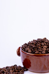 Close-Up of Coffee Beans in a Brown Bowl on White Table