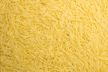 Uncooked Filini Pasta: A Culinary Canvas of Noodles, Creating a Lively and Textured Background for Gourmet Cooking. Dry Pasta. Raw Macaroni - Top View, Flat Lay