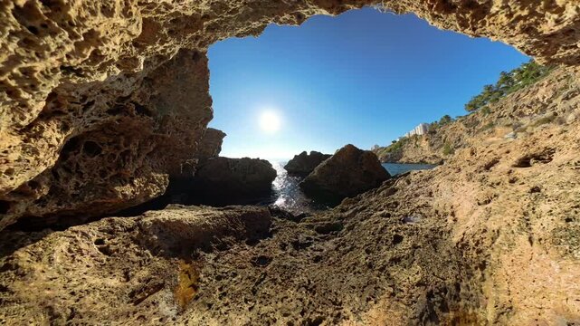 Zoom in, Rocks, cave, sun, sea, sky, coastal, nature, outdoors, sunlight, rugged, shoreline, water, beach, scenic, coastline, natural frame, sunlight casting, exploration, horizon, rock formation, coa