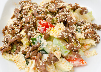 salad with avocado and beef fillet