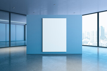 Obraz premium Modern empty spacious concrete office or exhibition hall interior with empty white mock up frame, panoramic windows and city view. 3D Rendering.