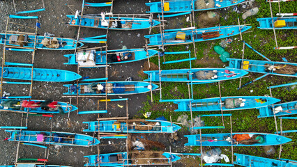 Fototapeta premium High-Angle Footage: Cluster of Fishing Vessels at Anchor