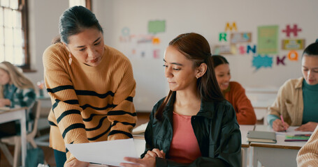 Teacher, test and education with girl in classroom for learning, entrance exam and scholarship....