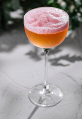 Elegant frothy cocktail on textured surface