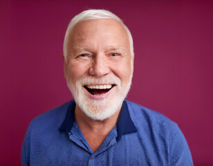 Fototapeta premium Headshot Portrait of a Smiling Mature Man with Contemporary Style, Isolated on Color Background with Ample Copy Space