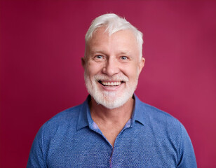 Headshot Portrait of a Smiling Mature Man with Contemporary Style, Isolated on Color Background with Ample Copy Space