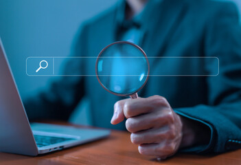 businessman using a laptop show a search bar. concept of keyword search engines, web browser information, SEO optimization, tool digital online. a website to find a job and career on the internet
