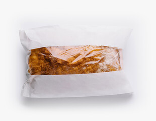 Sealed bread loaf in transparent packaging