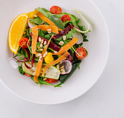 Fresh citrus mixed salad on white background