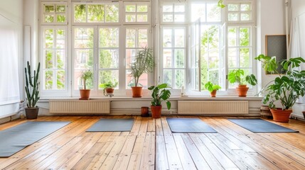 Fototapeta premium Sunlit Room with Yoga Mats and Plants by a Window