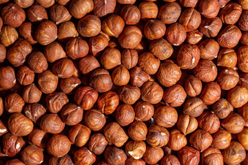 Scattered Peeled Hazelnut - Top View. Background from Hazelnuts. Natural High-Calorie Snacks