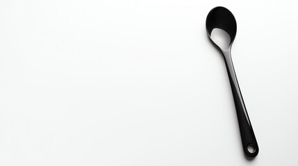Black spoon on white background.