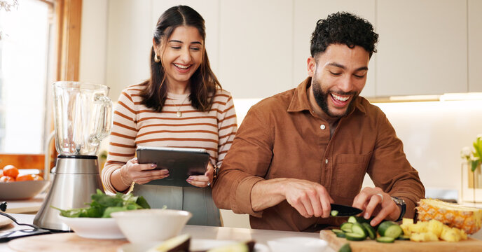 House, cooking and couple with tablet, funny and bonding together with online recipe. Apartment, man or woman in kitchen, vegetables or tech with organic food, ingredients or website for nutrition - Powered by Adobe